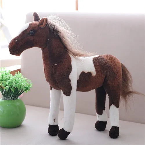 Collectible horse and zebra plush dolls.
