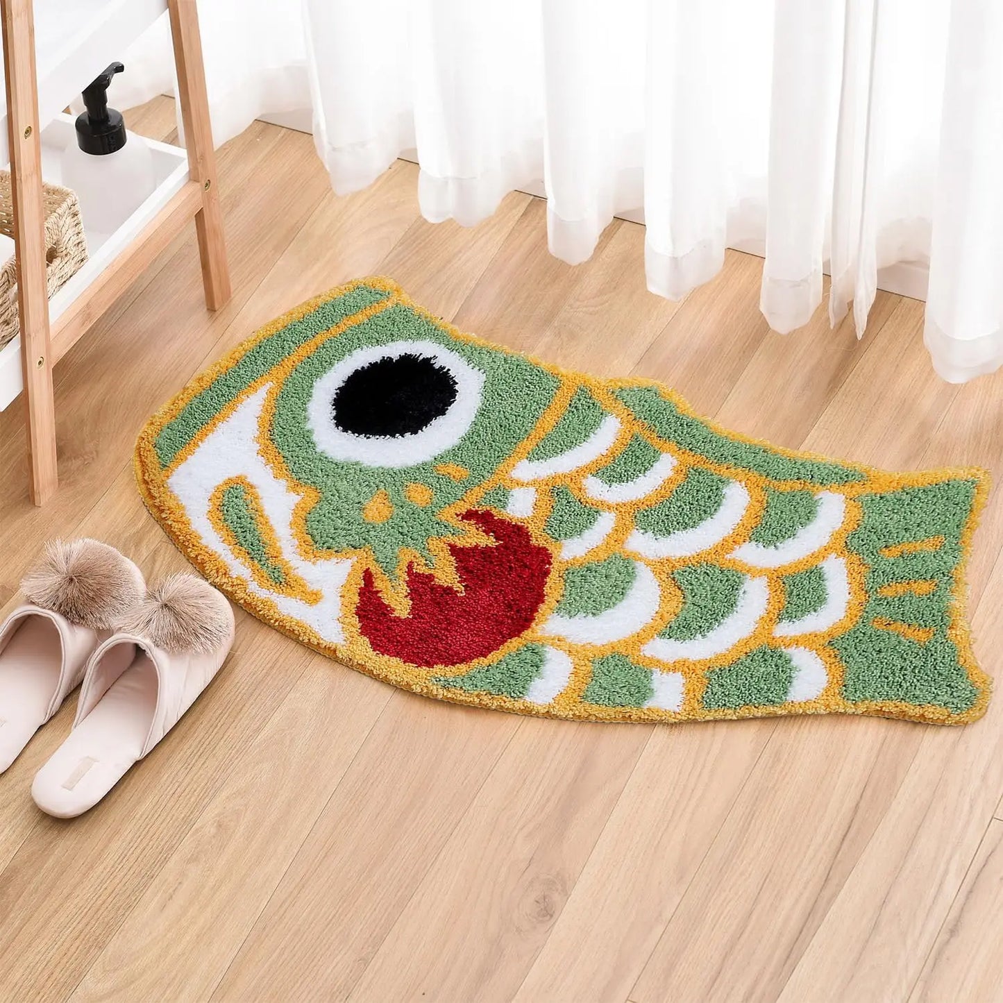 Green fish shaped rug near window with slippers