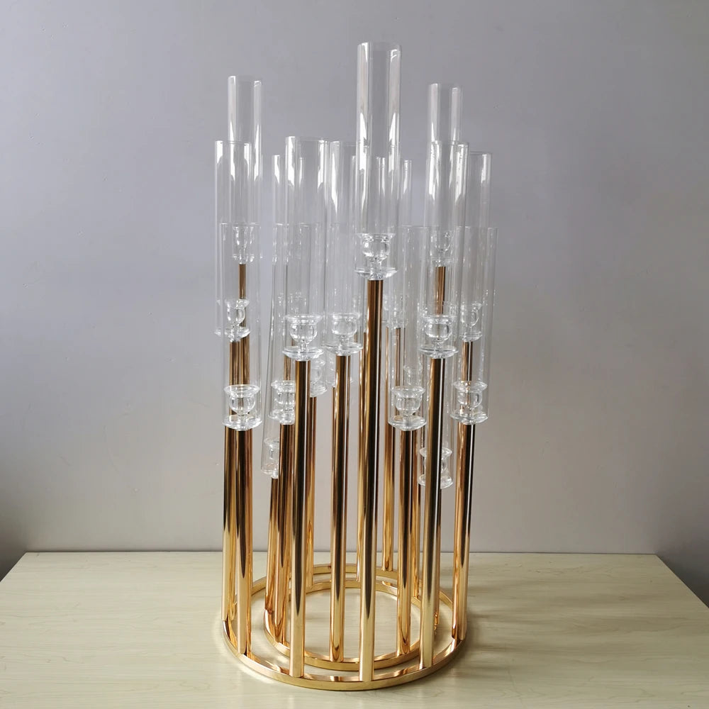 12-arm tall gold candelabra centerpiece with clear glass candle sleeves.