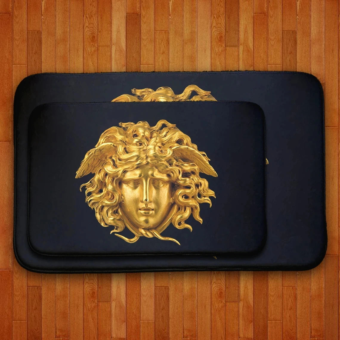 Black and gold designer Medusa doormat for stylish interiors.
