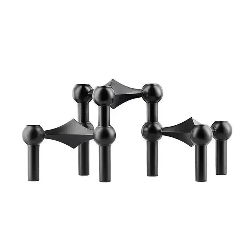 Minimalist black molecular candlestick set for contemporary decor.