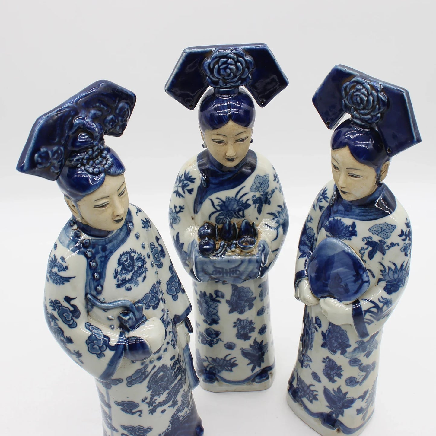Blue and white ceramic empress collectible figurine.