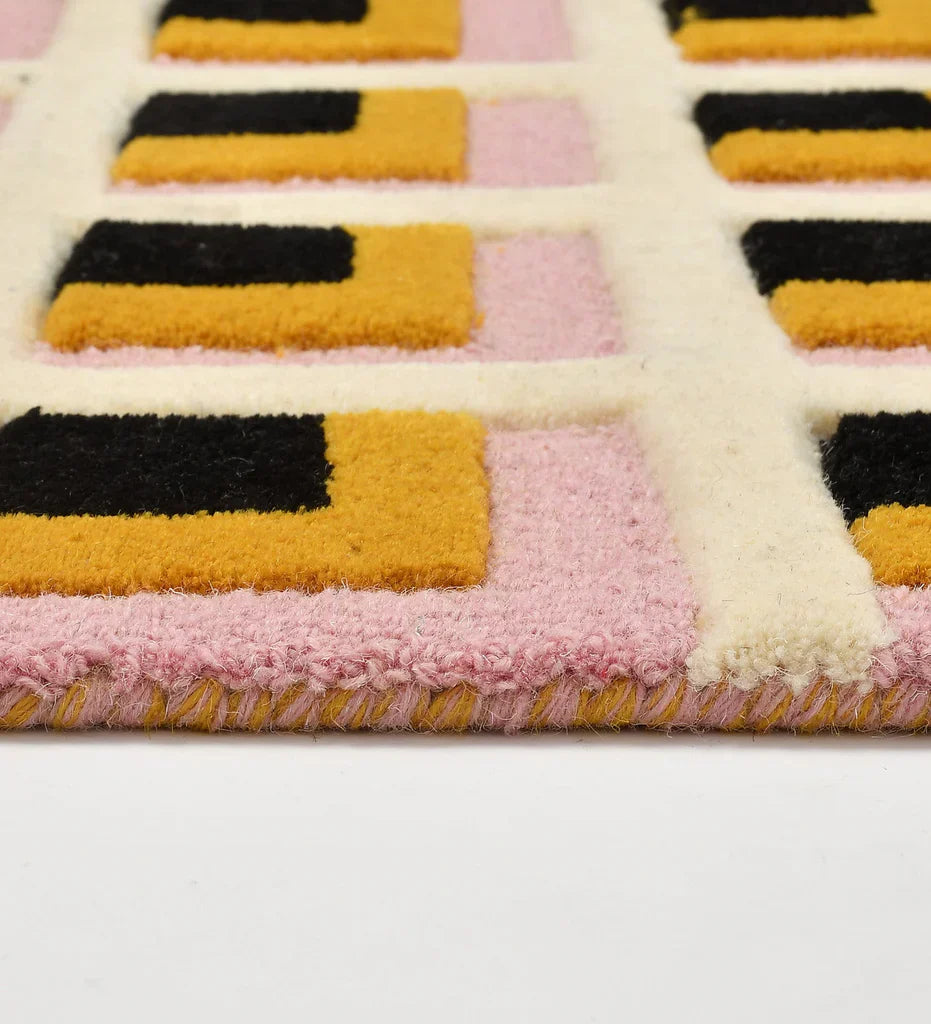 Contemporary hand-tufted rug with pink and mustard square pattern