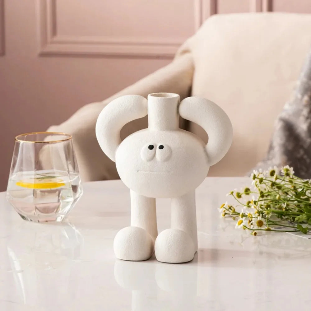 Circular hollow resin vase with modern abstract sculptural design.