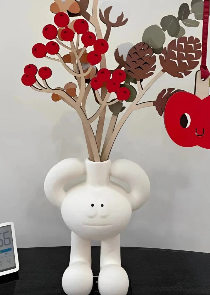 Resin vase collection featuring knot, figure, and round hollow styles.