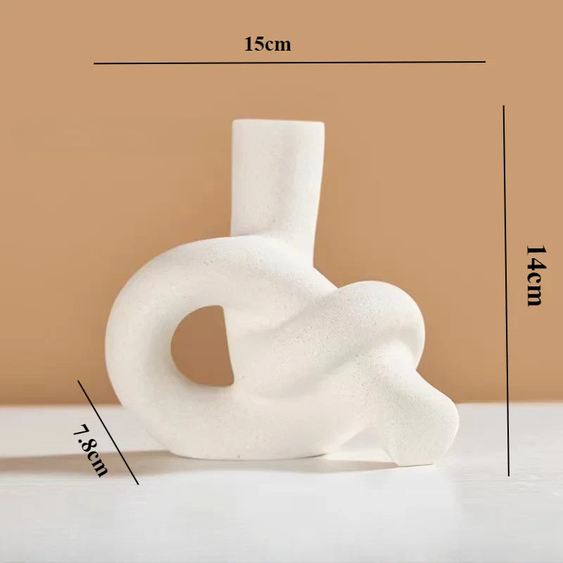 White resin knot-shaped vase for modern interior decoration.