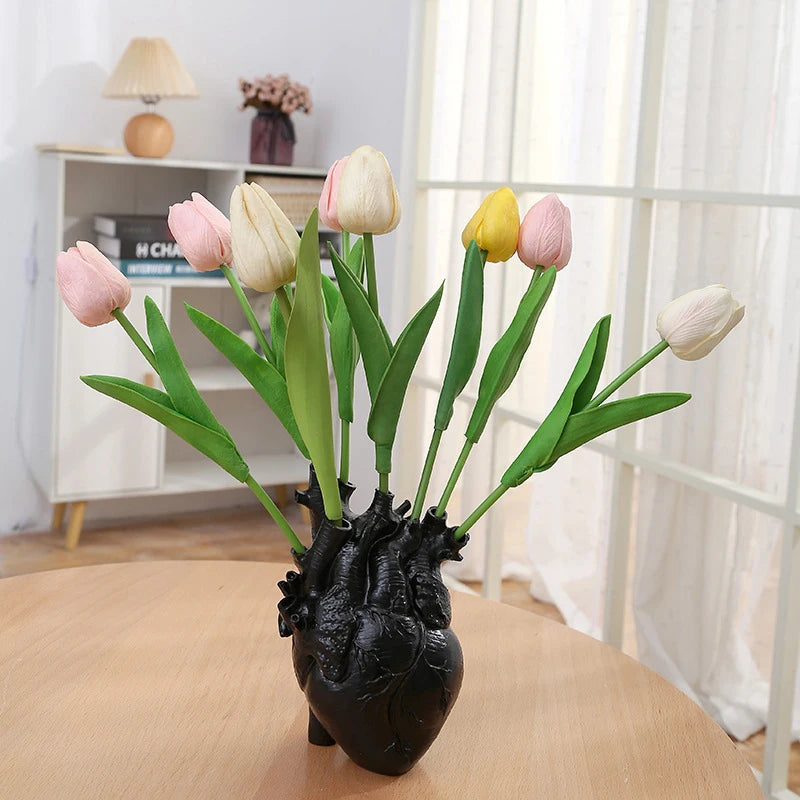 Black artistic heart sculpture vase for luxury interiors.