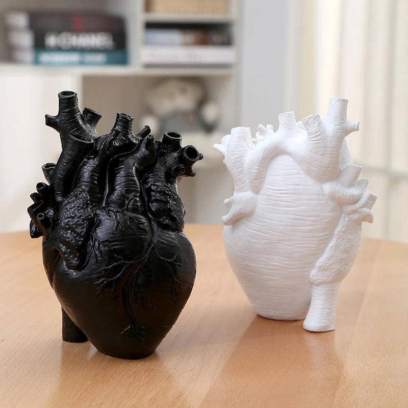 Realistic heart sculpture vase for modern interior styling.