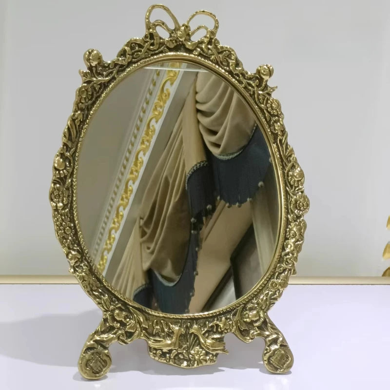 European-style vanity mirror with intricate gold detailing.