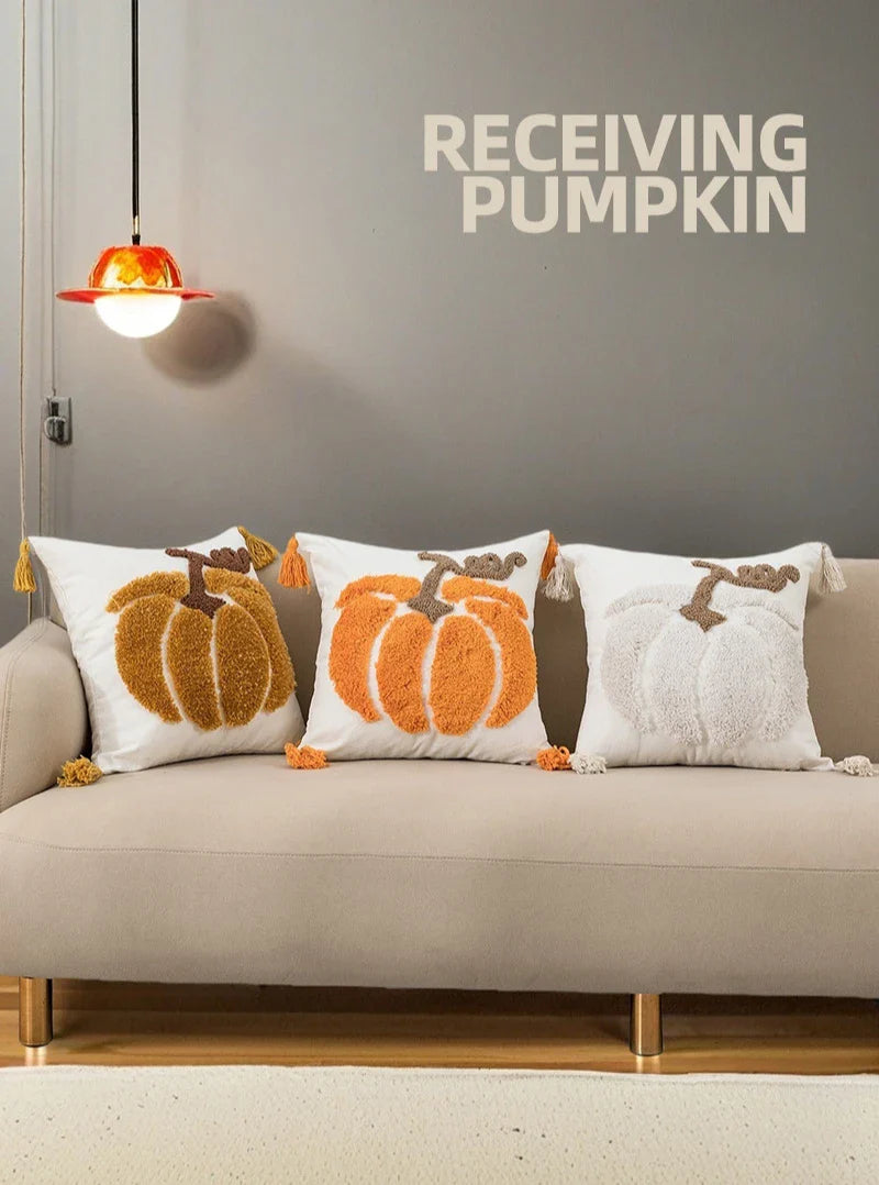 Square pumpkin throw pillow with tassels and tufted design