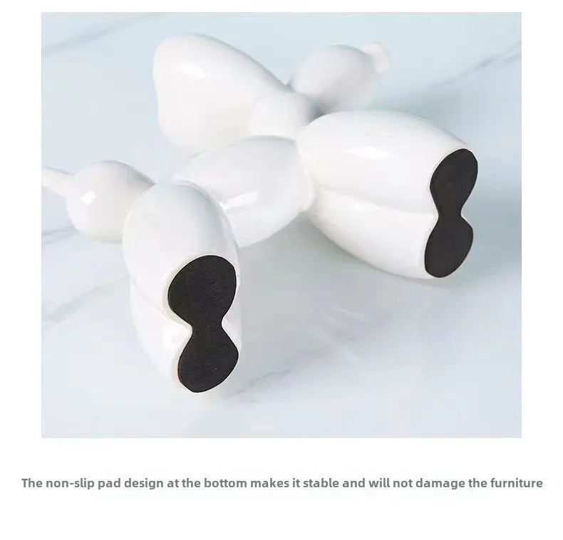 Modern pop art balloon dog statue in navy blue ceramic.