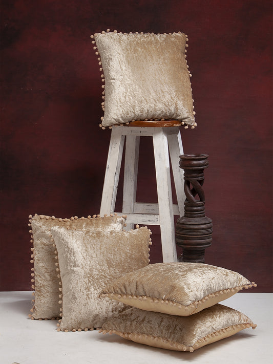 Beige solid velvet pillow covers with pom pom detailing - set of 5 luxury decorative cushions for living room and bedroom décor.