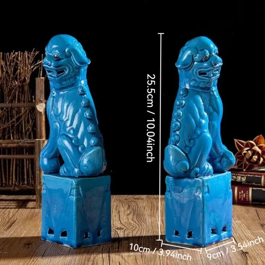Cultural Chinese guardian lion statues in blue enamel.