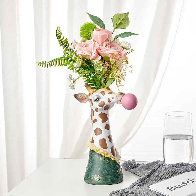 Giraffe bubble-blowing resin art vase for modern home décor.
