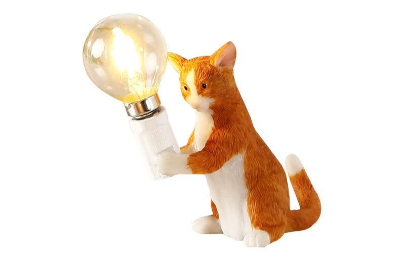 Orange resin cat decorative desk lamp.