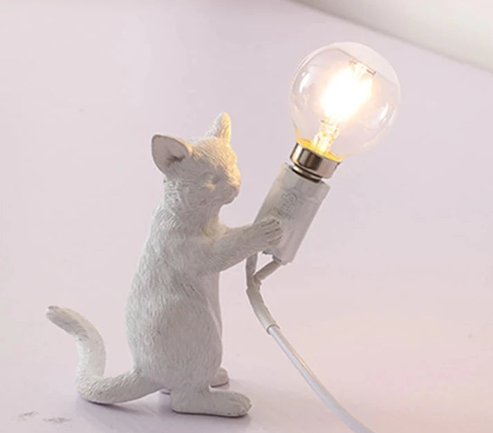 White resin cat nightstand lamp for kids’ bedroom.