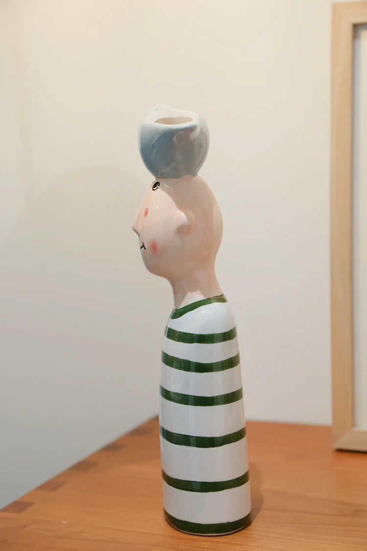 Artistic couple vases with birds on heads for flowers.