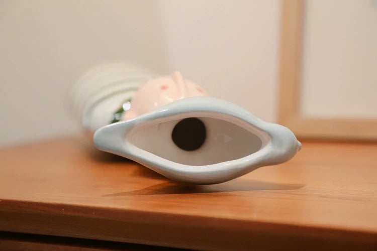 Decorative ceramic sculpture vases for gifting purposes.