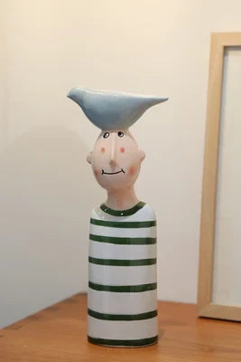 Artistic modern ceramic face vases for stylish interiors.