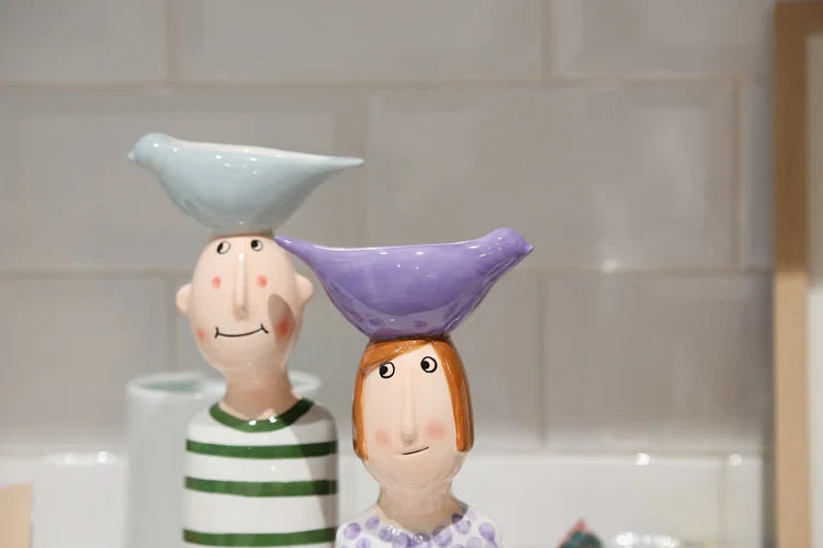 Modern ceramic sculpture vases for desktop décor.