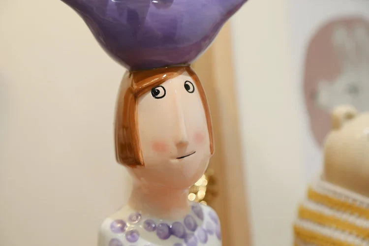 Hand-painted ceramic couple vases with unique design.