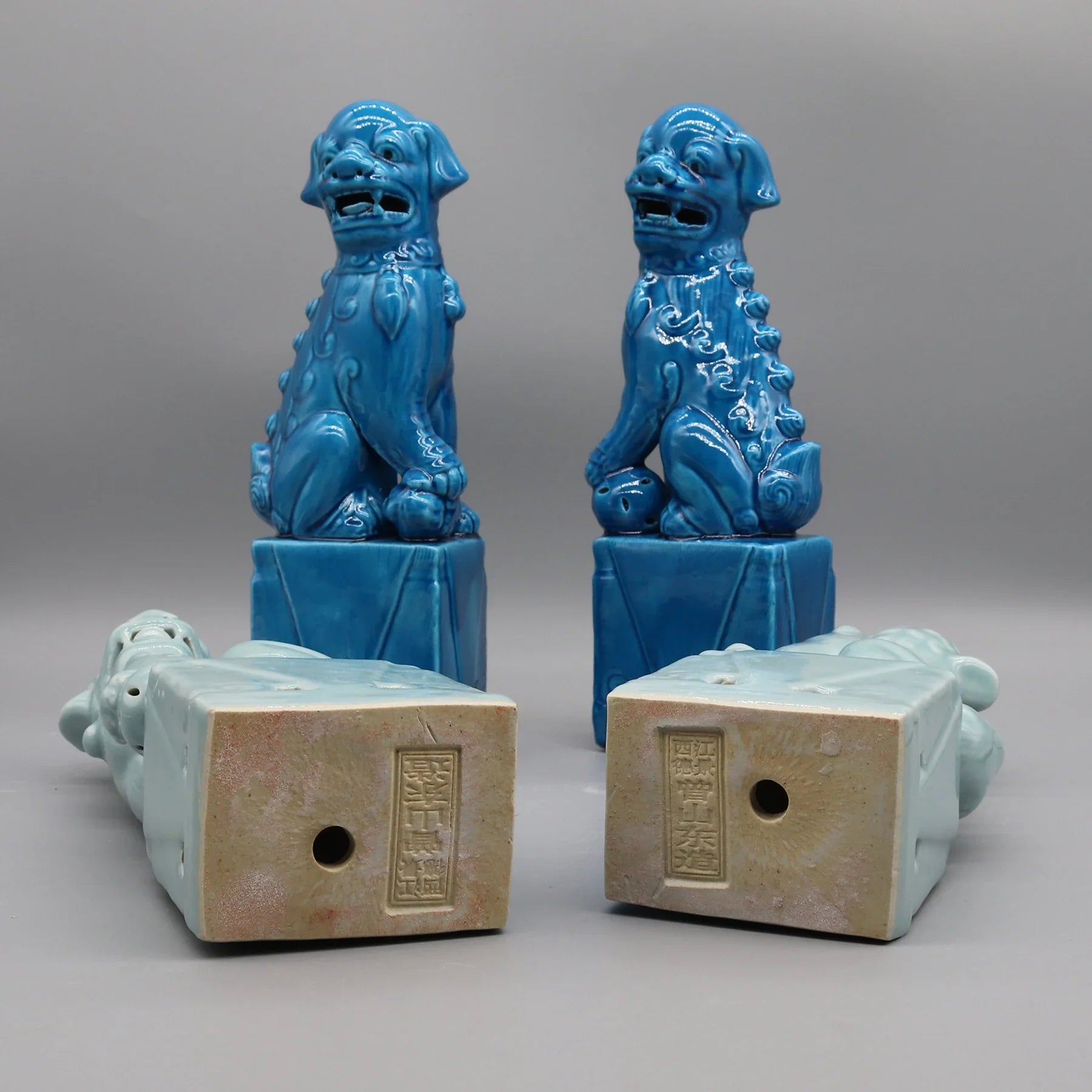 Pair of dark blue ceramic Foo Dogs for entryway décor.