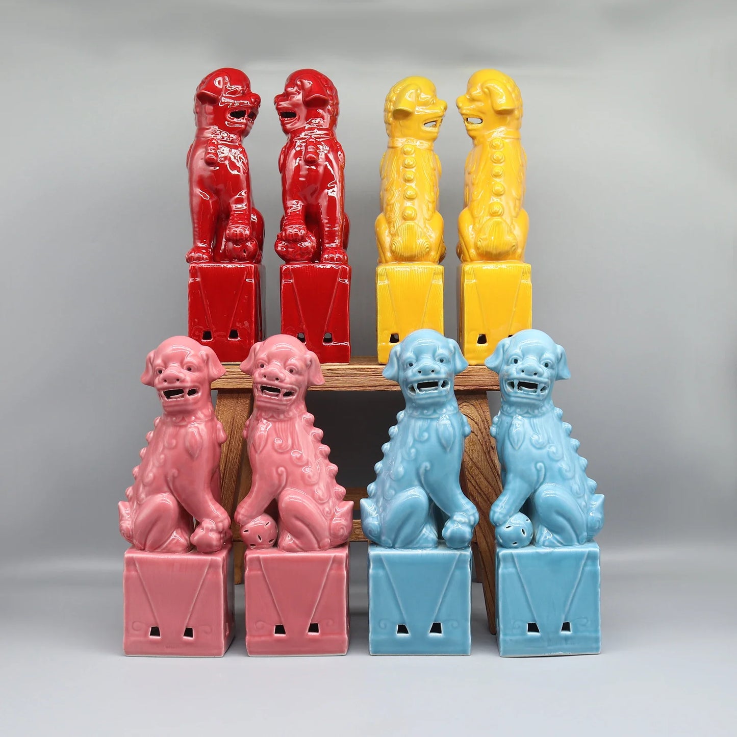 Red enamel Foo Dogs ceramic Feng Shui guardian statues.