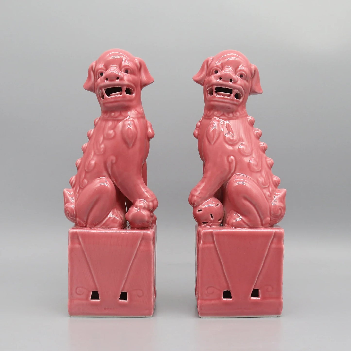 Pink ceramic Foo Dogs guardian lions Feng Shui décor.