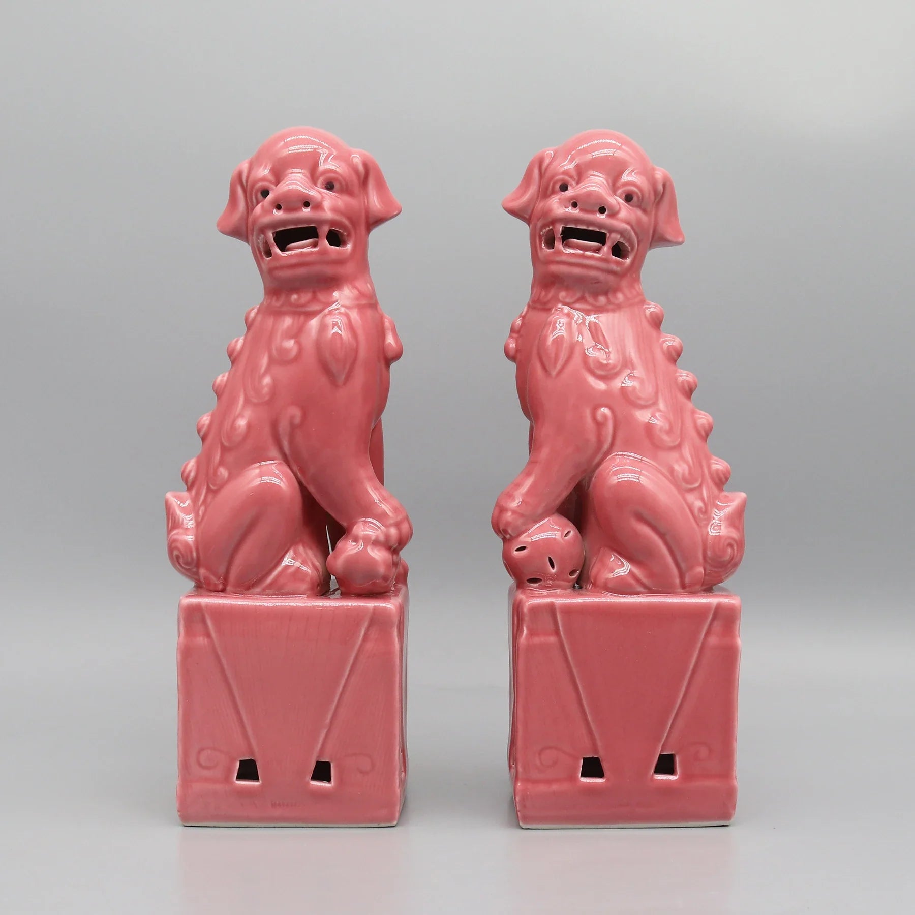 Pink ceramic Foo Dogs guardian lions Feng Shui décor.