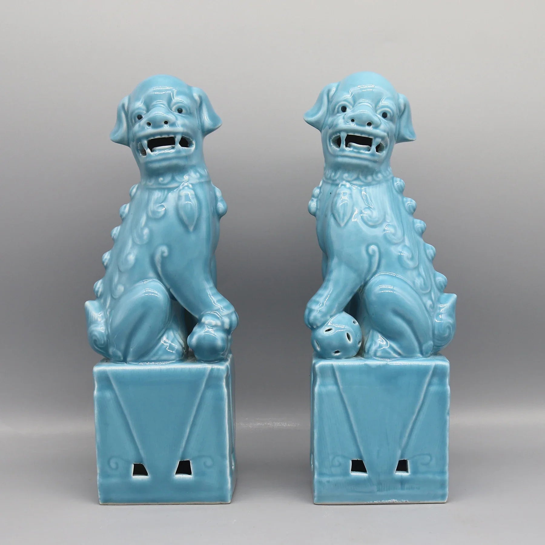 Cyan ceramic Foo Dogs pair Chinese protective statues.