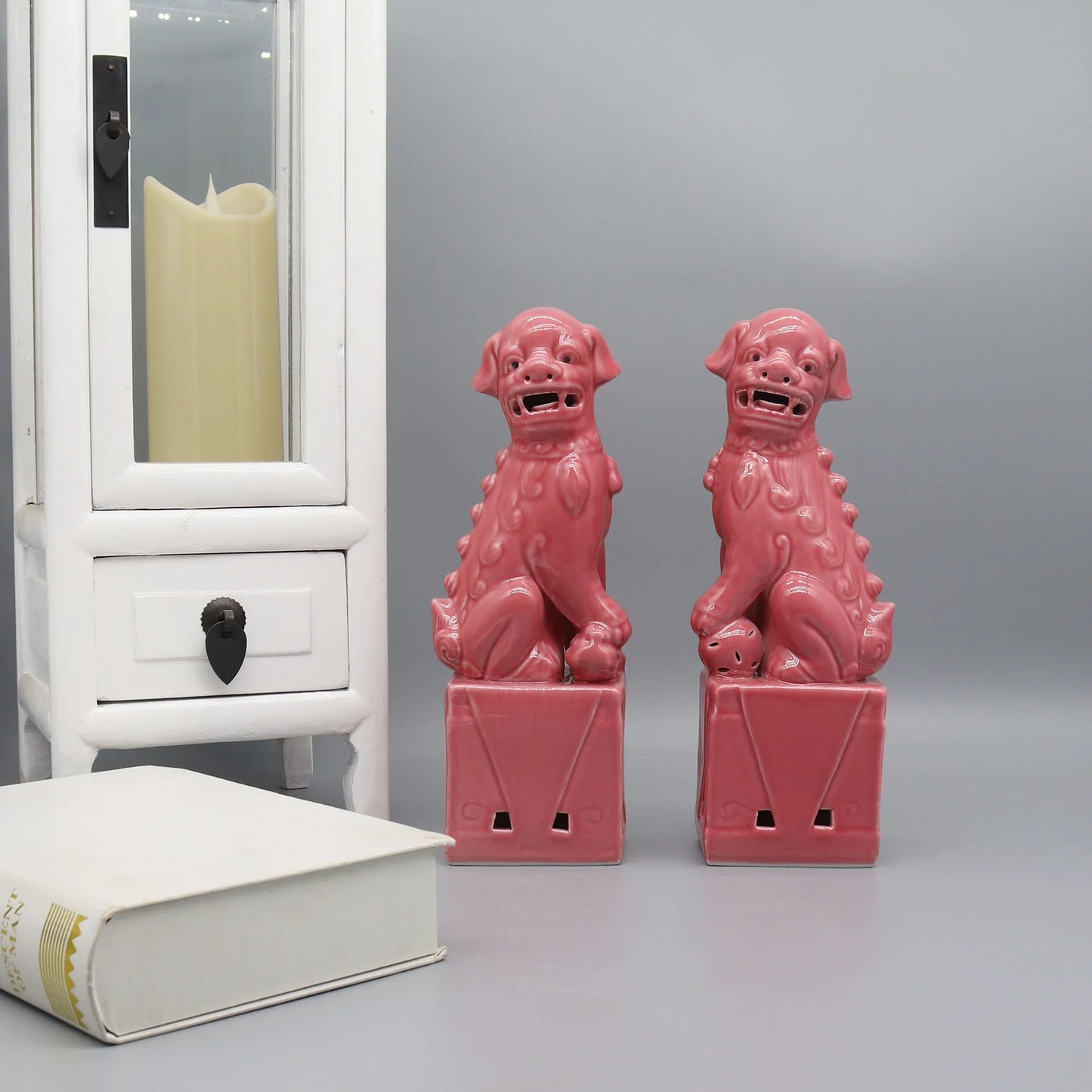 Pink ceramic Foo Dogs Feng Shui guardian lion pair.