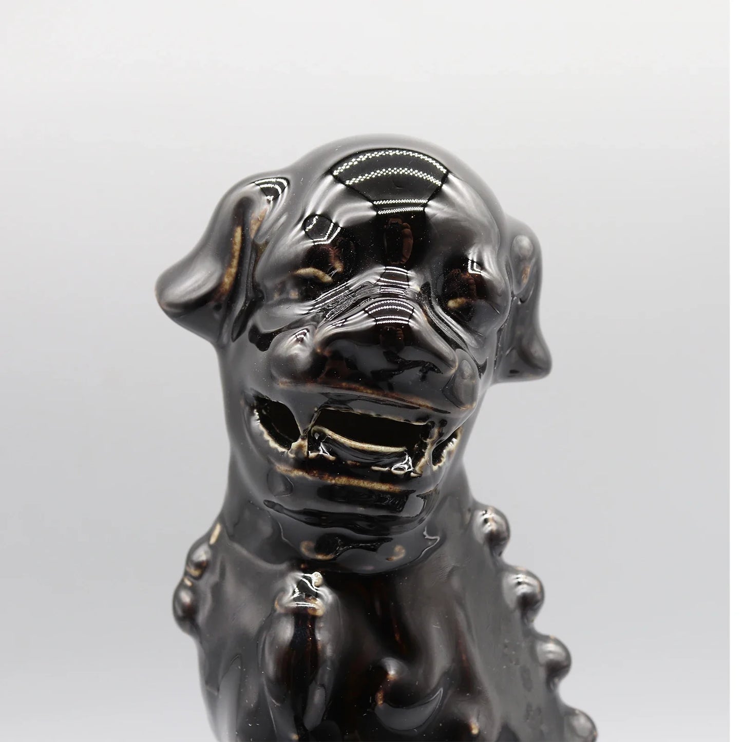 Black Foo Dogs ceramic lion pair Feng Shui sculptures.
