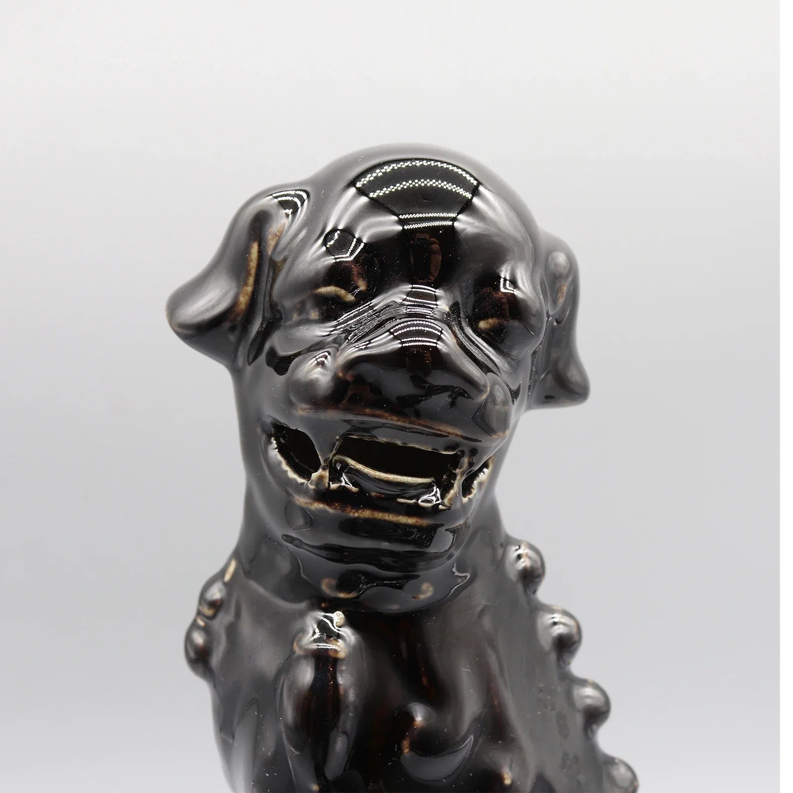 Black Foo Dogs ceramic lion pair Feng Shui sculptures.