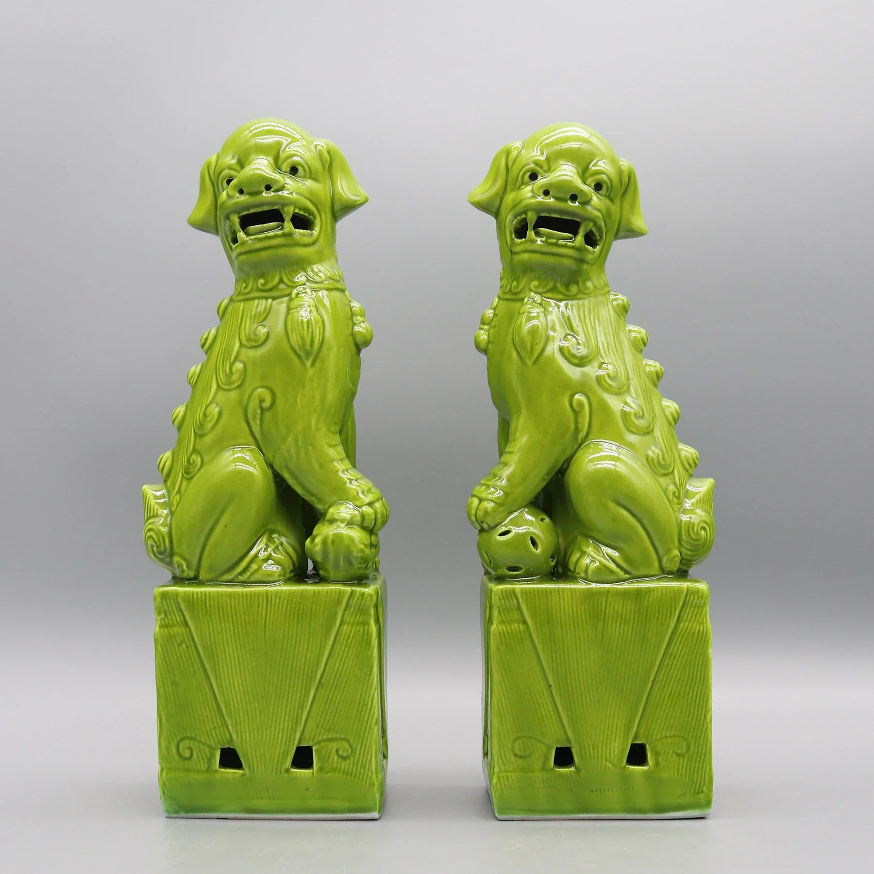 Green ceramic Foo Dogs pair Feng Shui home accents.