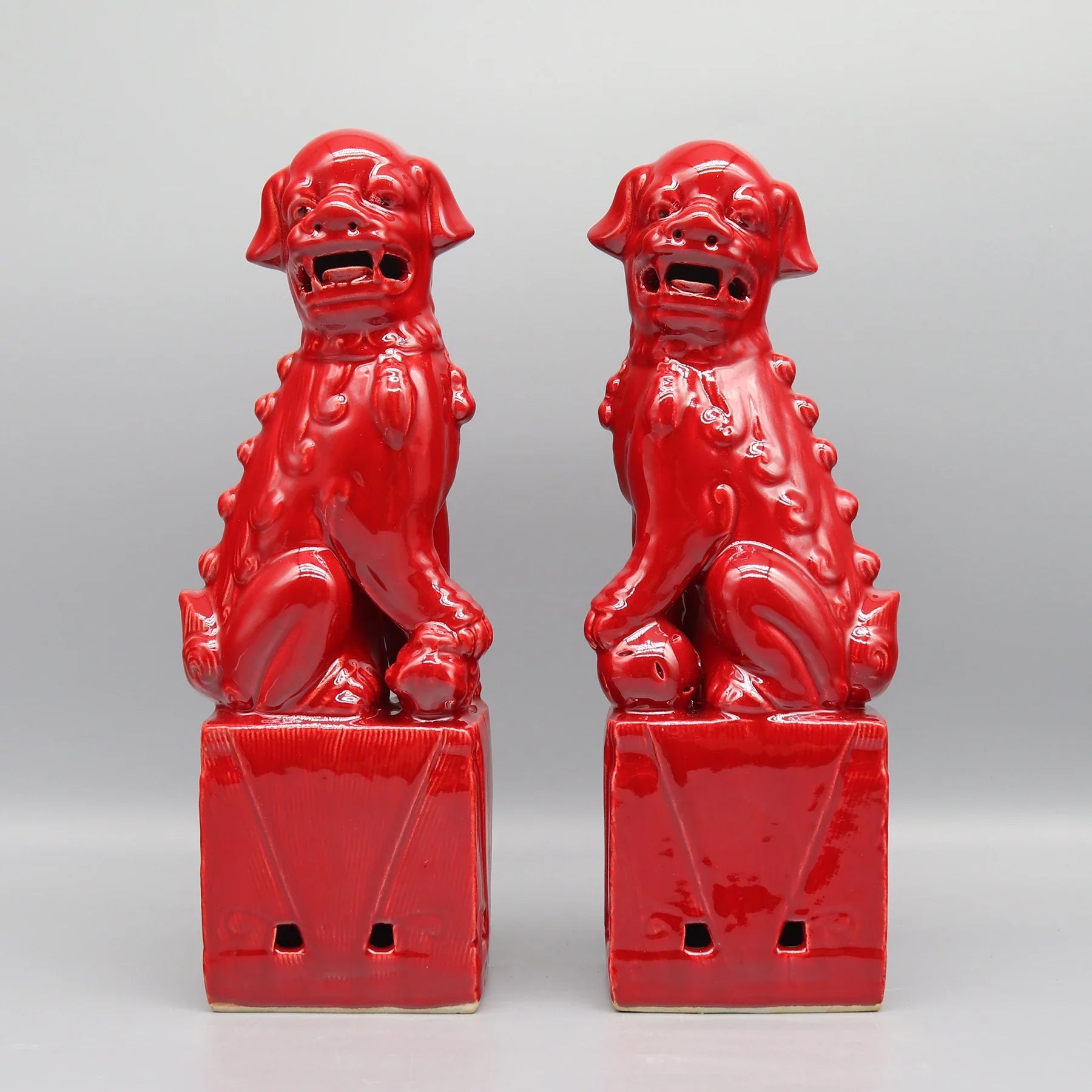 Red ceramic Foo Dogs pair Feng Shui decorative lions.