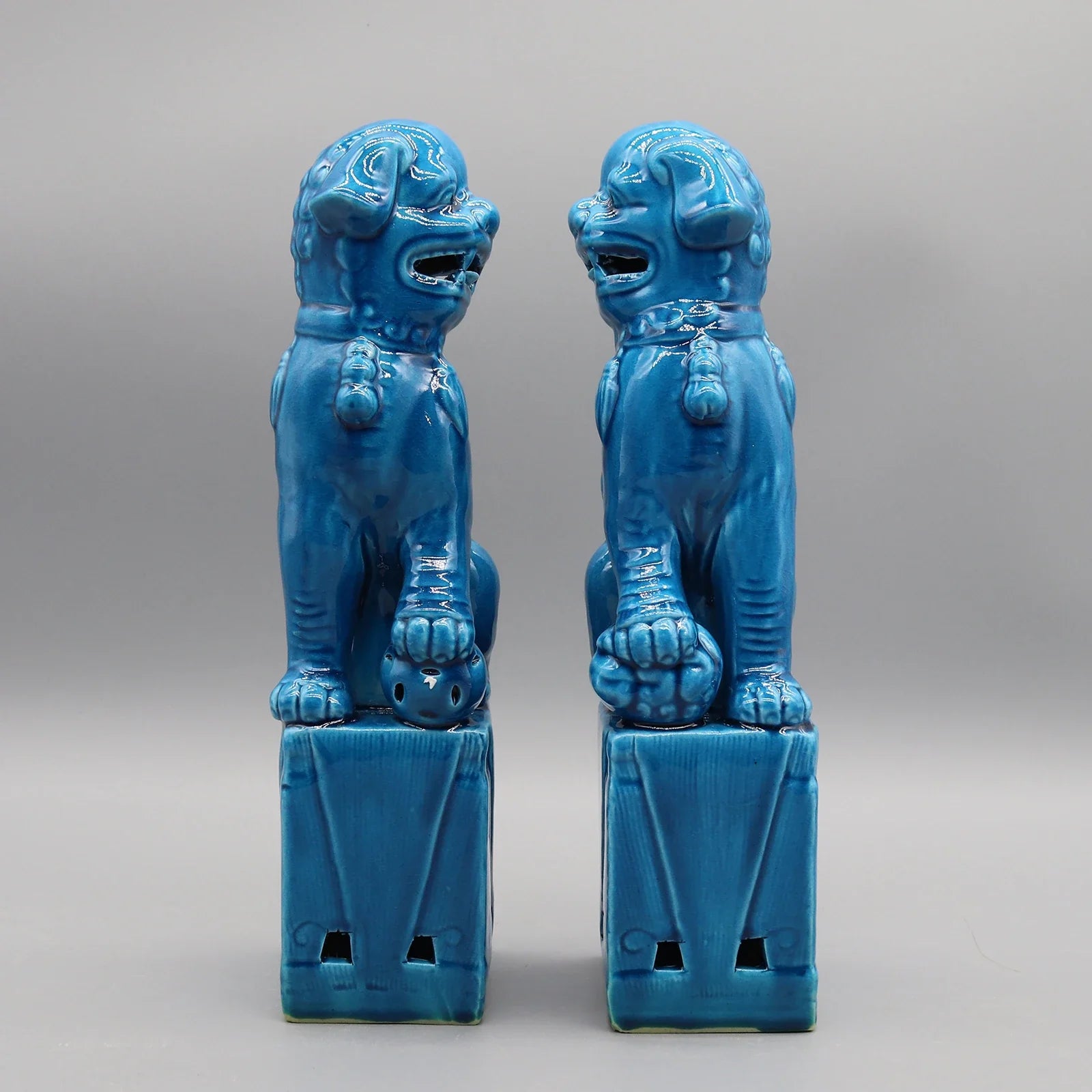Turquoise Foo Dogs ceramic pair with glossy enamel finish.