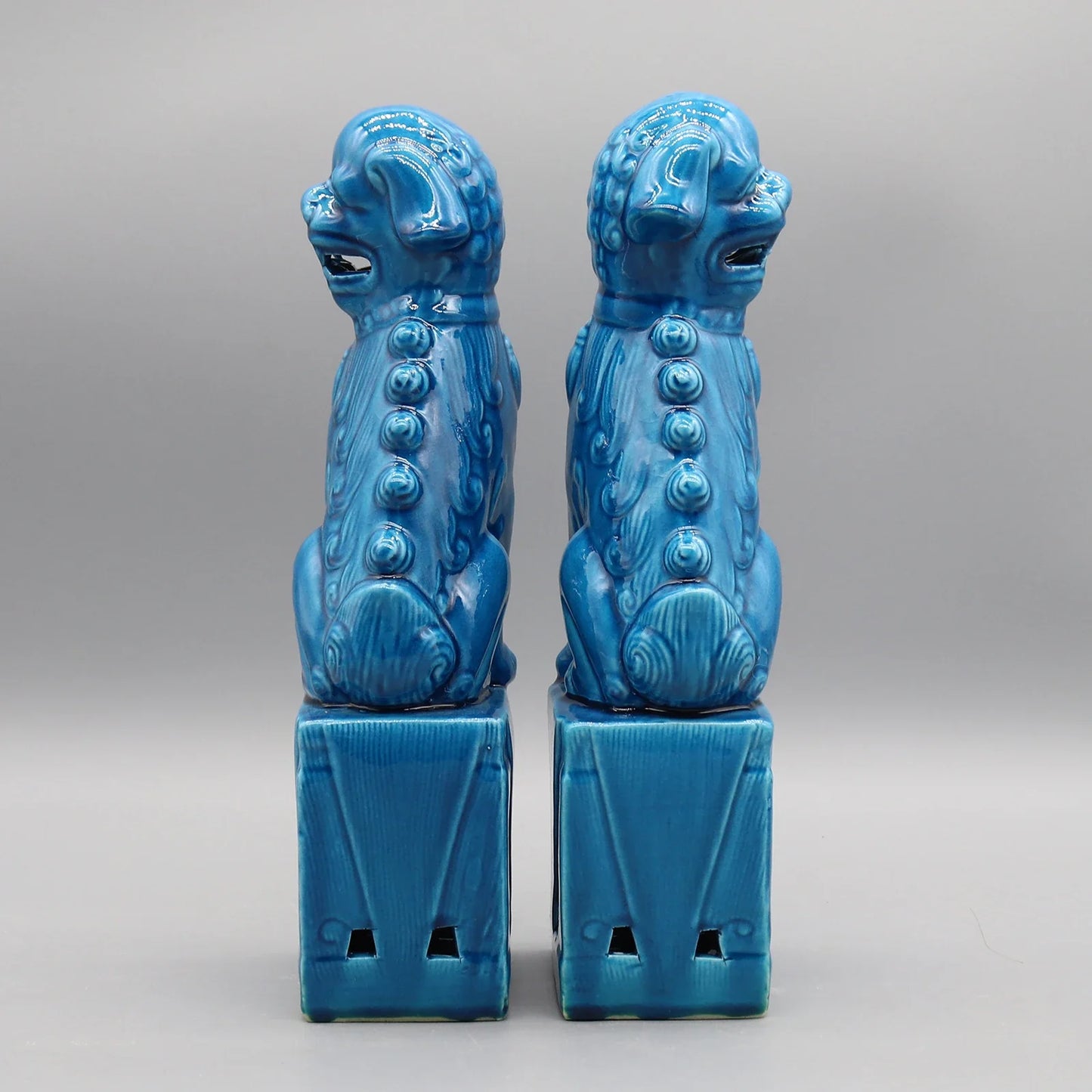Feng Shui Foo Dogs ceramic statues in turquoise glaze.