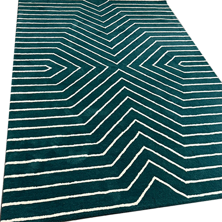 Soft plush hand-crafted wool area rug with geometric design.