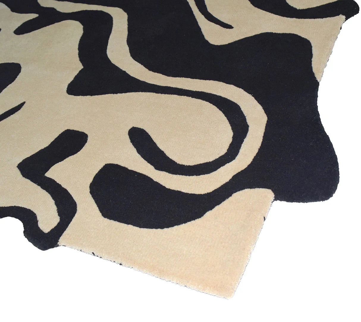 Handcrafted luxury wool rug with fluid black stripe design on beige base.