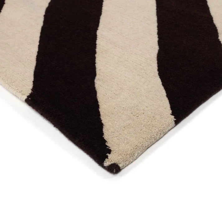 Premium hand-tufted wool rug with contemporary abstract stripe texture.