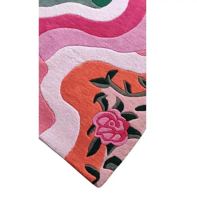 Close-up view of the Floral Wavefront Hand Tufted Area Rug showcasing its vibrant pink, orange, and green wave patterns with a floral design. This wool rug is perfect for adding a touch of elegance to living rooms or dining areas, and its 8x10 size makes it an ideal choice for spacious settings.