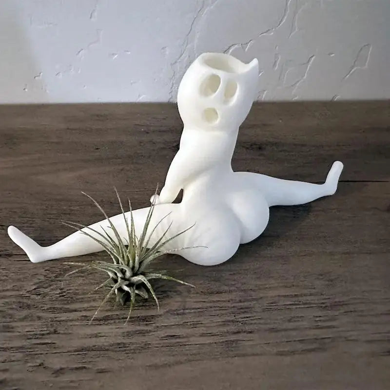 Funny big booty ghost planter for succulent display.