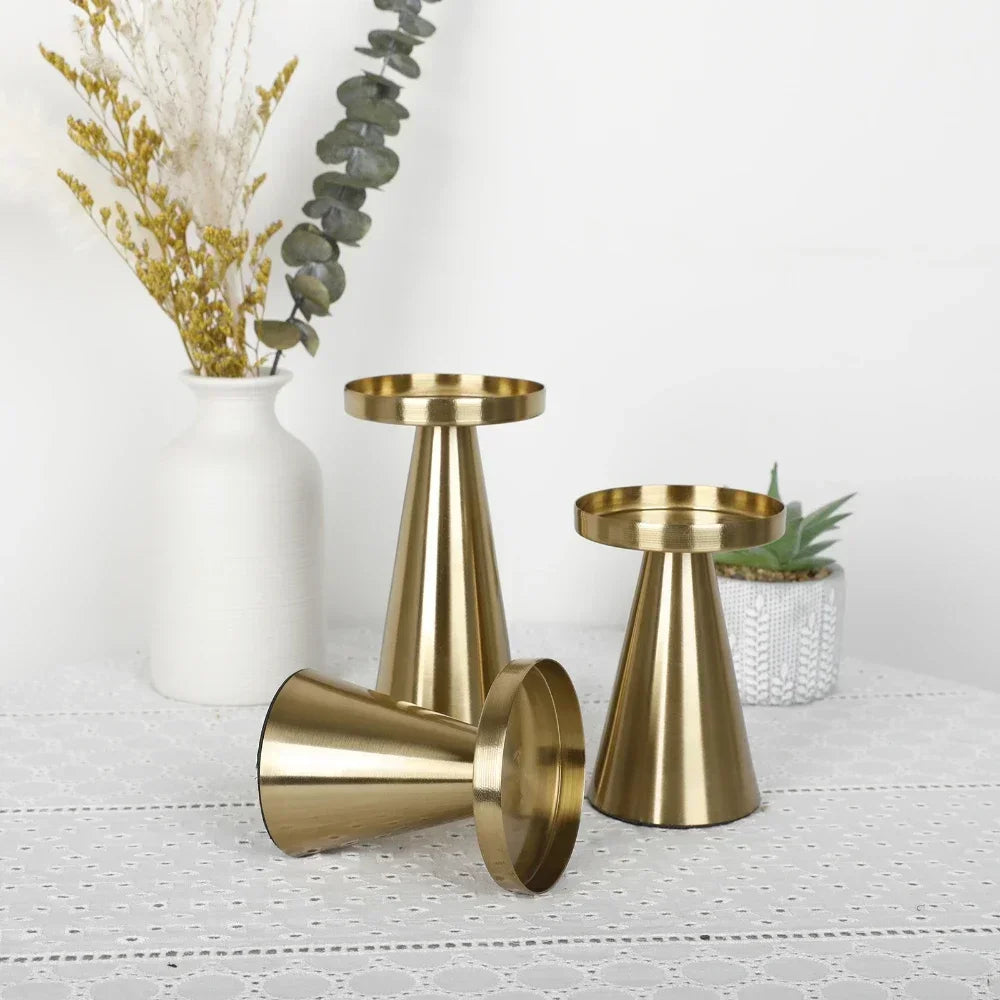 Modern golden candle stand for pillar candles.