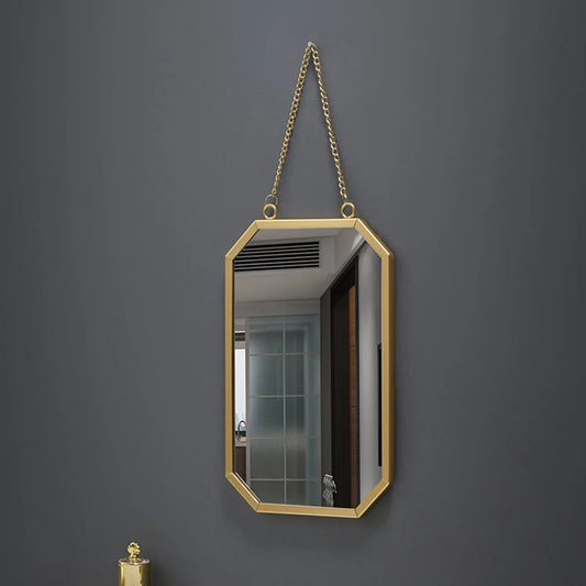 Golden framed rectangular wall mirror with hanging chain for bathroom.