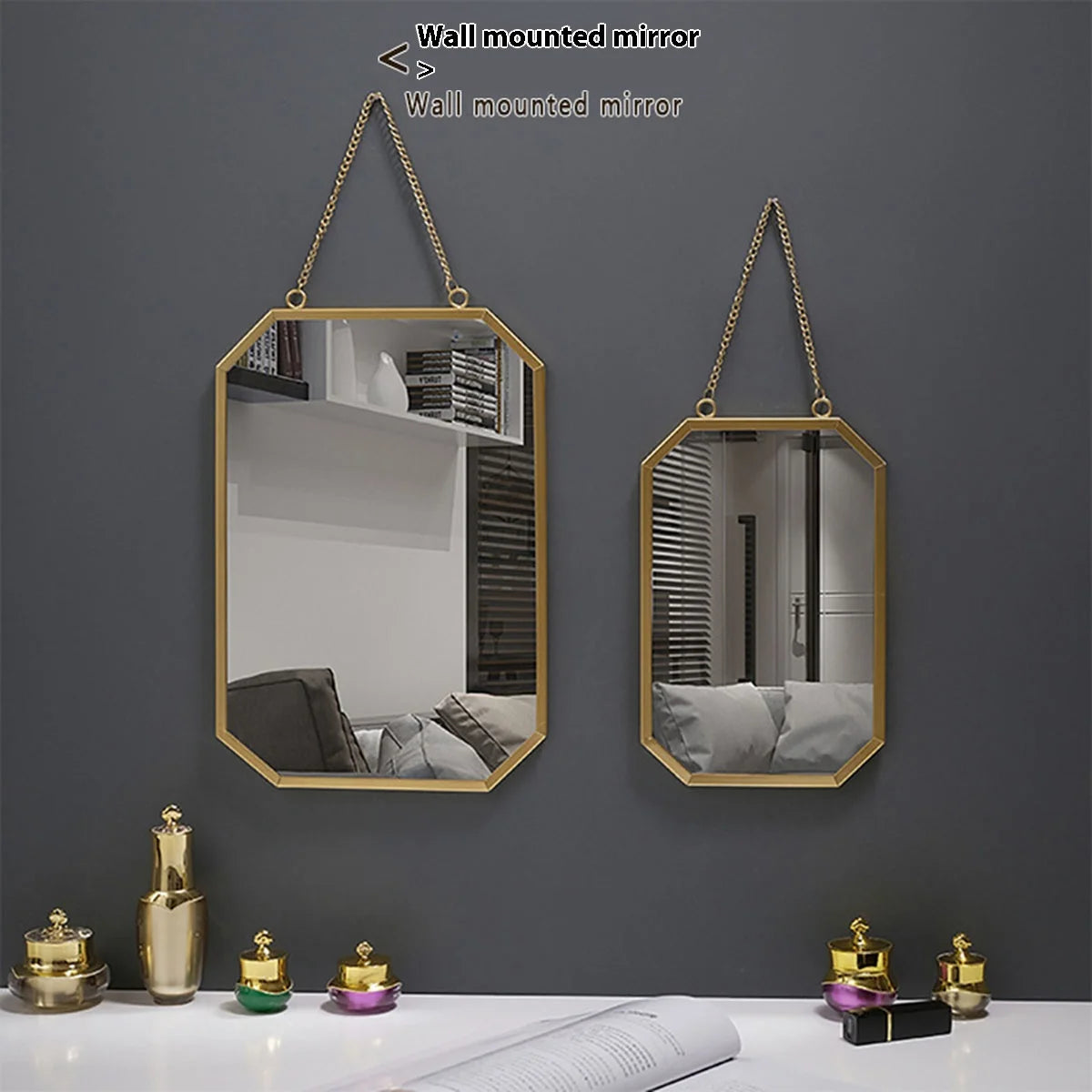 Rectangular gold wall mirror with minimalist metallic frame.