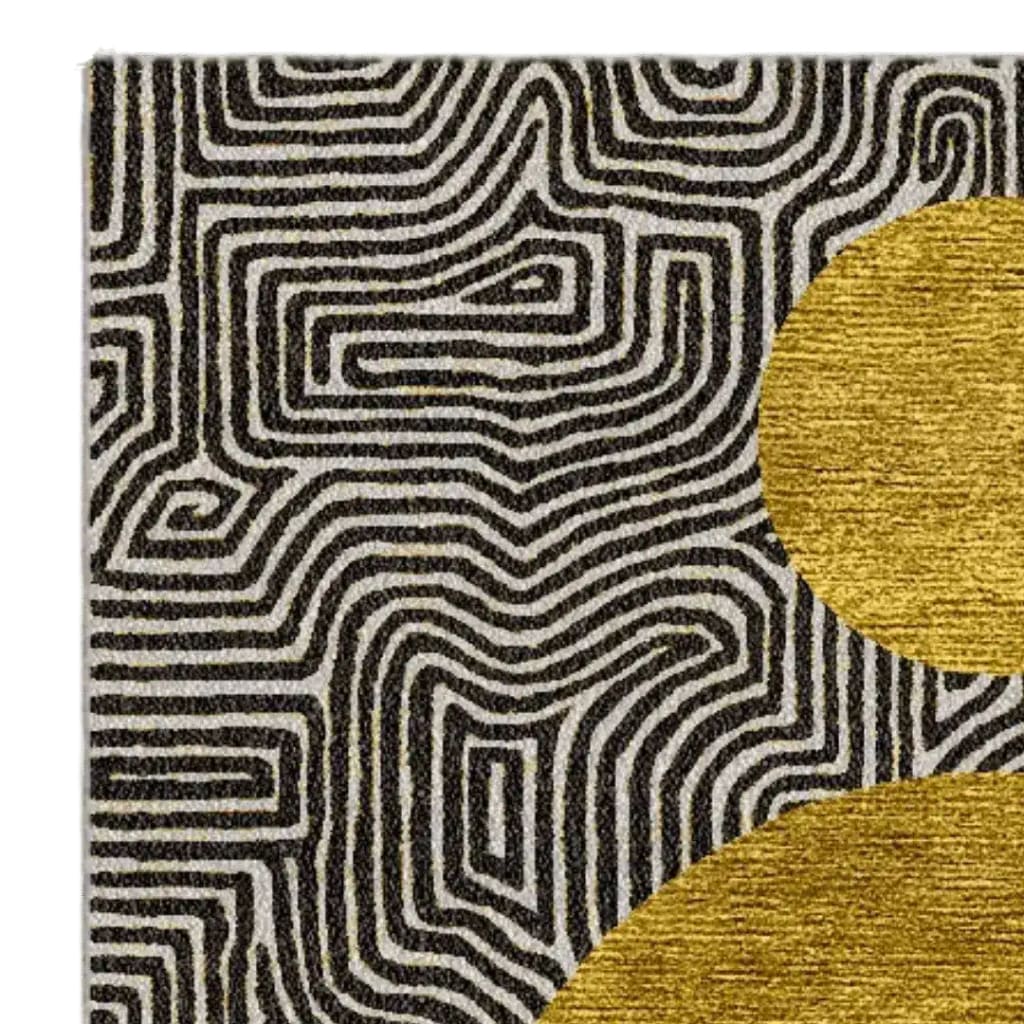 Close-up of a Three Golden Suns Maze Hand Tufted Wool Rug showcasing an intricate black and white maze pattern with a bold golden sun motif. This large area rug, perfect for a living room, adds a touch of modern artistry and luxury to any space. Ideal for those seeking unique living room rugs 8x10.