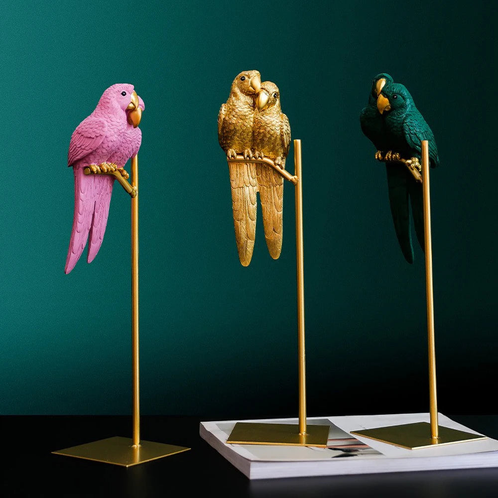 Handcrafted couple parrot resin sculpture on gold stand.