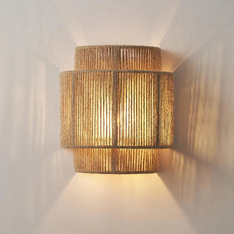 Handmade rattan woven wall lamp with rustic hemp rope design.