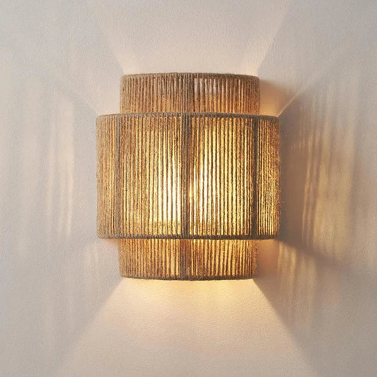 Handmade rattan woven wall lamp with rustic hemp rope design.