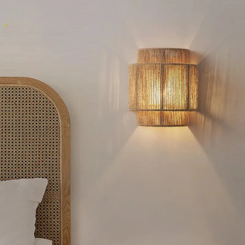 Vintage woven rattan wall lamp with wood and LED bulb.